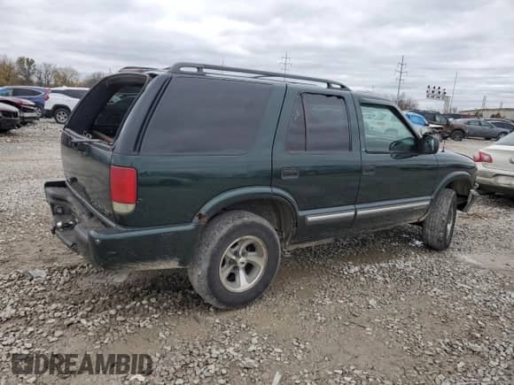 2001 Chevrolet Blazer LS с VIN 1GNCS13W91K254624, выставлен на аукционе Copart как лот 80281444 с пробегом 189 843 миль миль и Списание • Salvage title. История ставок и продаж доступна на DreamBid. Изображение 3.