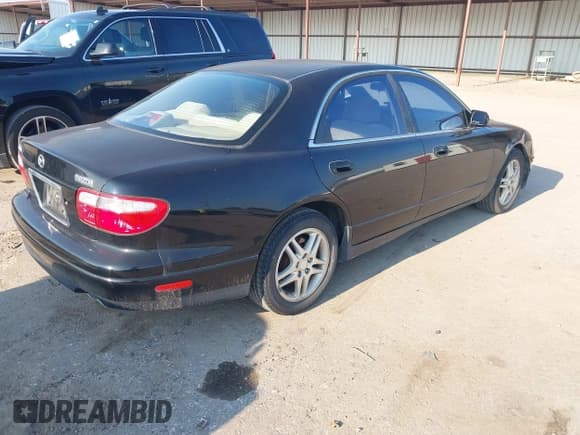 ✅ 1999 Mazda Millenia • VIN: JM1TA2217X1512130 • Lot: 43084659. Wystawiony na IAAI z przebiegiem 82 008 mil. Bezpłatny archiwum sprzedaży aukcyjnych z USA i szczegółowy raport historii pojazdu na DreamBid. Zdjęcie 4.