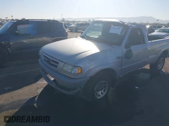 ✅ 2002 Mazda B-Series DS • VIN: 4F4YR12U22TM11858 • Лот: 40819886. Опубликован ранее на IAAI с пробегом 104 051 миль. Бесплатный доступ к архиву аукционных продаж из США и подробный отчёт об истории автомобиля на DreamBid. Изображение 2.