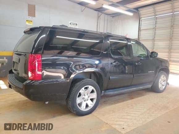 ✅ 2011 GMC Yukon XL SLT • VIN: 1GKS2KE35BR102009 • Lot: 82187725. Listed on Copart with 128,787 mi. Free auction sales archive from the USA and detailed vehicle history report at DreamBid. Image 3.