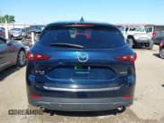 ✅ 2023 Mazda CX-5 S Carbon Edition • VIN: JM3KFBCM2P0250701 • Lot: 42272818. Listed on IAAI with 11,949 mi. Free auction sales archive from the USA and detailed vehicle history report at DreamBid. Image 17.