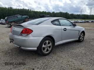 2005 Hyundai Tiburon GS с VIN KMHHM65D35U182780, выставлен на аукционе Copart как лот 58958295 с пробегом 186 652 миль миль и Чистый • Clean title. История ставок и продаж доступна на DreamBid. Изображение 3.