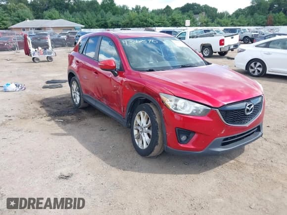 ✅ 2015 Mazda CX-5 Grand Touring • VIN: JM3KE4DY6F0507812 • Lot: 43062570. Listed on IAAI with 251,158 mi. Free auction sales archive from the USA and detailed vehicle history report at DreamBid. Image 1.