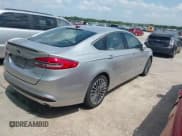 ✅ 2017 Ford Fusion Hybrid Titanium • VIN: 3FA6P0RU1HR317556 • Lot: 42549706. Listed on IAAI with 77,744 mi. Free auction sales archive from the USA and detailed vehicle history report at DreamBid. Image 4.