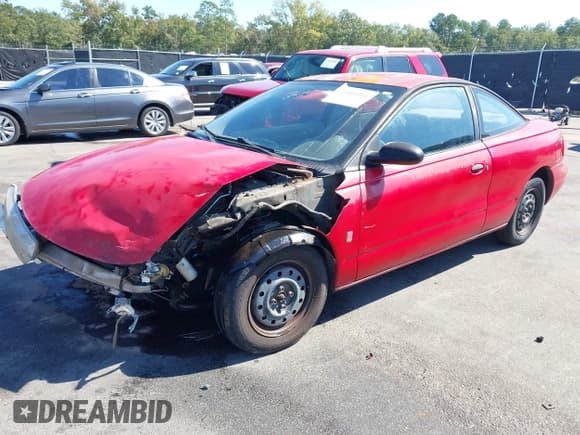 ✅ 1997 Saturn SC • VIN: 1G8ZF1280VZ261592 • Lot: 43468001. Listed on IAAI with 220,986 mi. Free auction sales archive from the USA and detailed vehicle history report at DreamBid. Image 2.