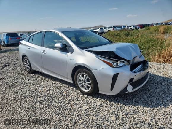 2021 Toyota Prius L Eco with VIN JTDKAMFU1M3150517, listed as a Copart auction lot 70697765 with 107,800 mi miles and Salvage title. Bid and sale history available at DreamBid. Image 4.