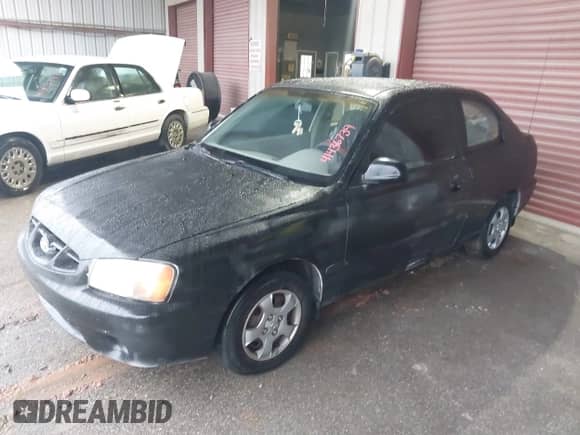 2001 Hyundai Accent GS with VIN KMHCG35C81U090873, listed as a IAAI auction lot 41436739 with 59,359 mi miles and . Bid and sale history available at DreamBid. Image 2.
