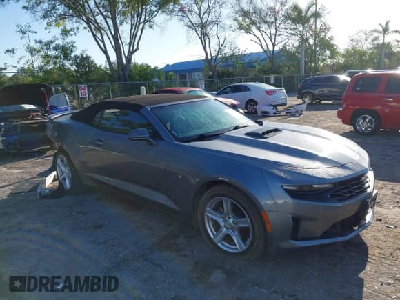 ✅ 2020 Chevrolet Camaro 1LT • VIN: 1G1FB3DXXL0105753 • Lot: 42265211. Listed on IAAI with 51,939 mi. Free auction sales archive from the USA and detailed vehicle history report at DreamBid. Image 1.
