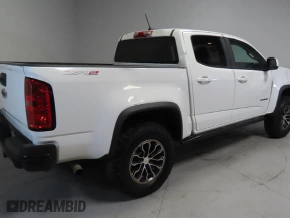 ✅ 2020 Chevrolet Colorado 4WD ZR2 • VIN: 1GCPTEE19L1134962 • Лот: 59032865. Опубликован ранее на Copart с пробегом 143 010 миль. Бесплатный доступ к архиву аукционных продаж из США и подробный отчёт об истории автомобиля на DreamBid. Изображение 3.
