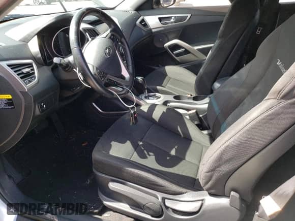 2017 Hyundai Veloster z VIN KMHTC6AD1HU322526, wystawiony jako Copart lot #49550693 z przebiegiem 47 781 mil mil oraz . Historia ofert i sprzedaży dostępna na DreamBid. Obrazek 7.