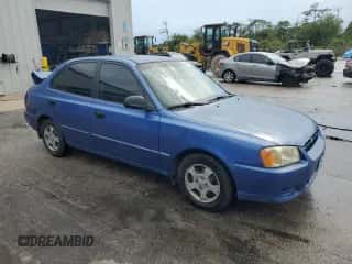 2002 Hyundai Accent GL z VIN KMHCG45C52U288494, wystawiony jako Copart lot #64835465 z przebiegiem 124 538 mil mil oraz Szkoda całkowita • Salvage title. Historia ofert i sprzedaży dostępna na DreamBid. Obrazek 4.