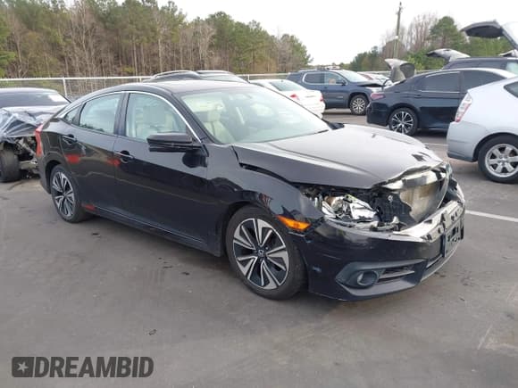 ✅ 2017 Honda Civic EX-T • VIN: 19XFC1F34HE204845 • Lot: 43822568. Listed on IAAI with 128,637 mi. Free auction sales archive from the USA and detailed vehicle history report at DreamBid. Image 1.