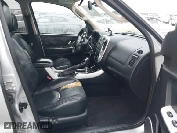 2005 Mercury Mariner Luxury z VIN 4M2CU561X5DJ16539, wystawiony jako IAAI lot #41572981 z przebiegiem 157 461 mil mil oraz . Historia ofert i sprzedaży dostępna na DreamBid. Obrazek 5.