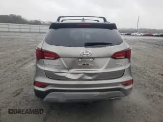 ✅ 2018 Hyundai Santa Fe 2.4L • VIN: 5XYZUDLB7JG570721 • Лот: 67084972. Опубликован ранее на Copart с пробегом 51 327 миль. Бесплатный доступ к архиву аукционных продаж из США и подробный отчёт об истории автомобиля на DreamBid. Изображение 6.