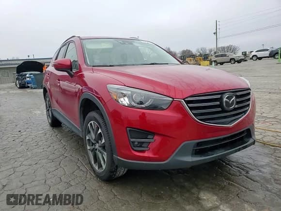✅ 2016 Mazda CX-5 Grand Touring • VIN: JM3KE2DY8G0707922 • Lot: 95433775. Wystawiony na Copart z przebiegiem 43 874 mil. Bezpłatny archiwum sprzedaży aukcyjnych z USA i szczegółowy raport historii pojazdu na DreamBid. Zdjęcie 14.