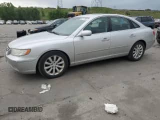 2009 Hyundai Azera GLS z VIN KMHFC46D39A349885, wystawiony jako Copart lot #60717555 z przebiegiem 172 329 mil mil oraz Czysty tytuł • Clean title. Historia ofert i sprzedaży dostępna na DreamBid. Obrazek 1.