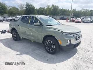 2023 Hyundai Santa Cruz SEL z VIN 5NTJCDAE5PH064434, wystawiony jako IAAI lot #43363723 z przebiegiem 13 727 mil mil oraz . Historia ofert i sprzedaży dostępna na DreamBid. Obrazek 1.