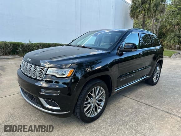 ✅ 2018 Jeep Grand Cherokee Summit • VIN: 1C4RJFJG4JC218011 • Lot: 91515965. Listed on Copart with 140,761 mi. Free auction sales archive from the USA and detailed vehicle history report at DreamBid. Image 2.