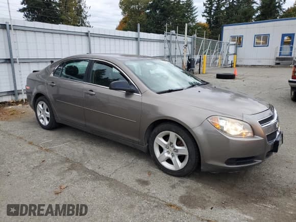 ✅ 2012 Chevrolet Malibu 1LS • VIN: 1G1ZB5E09CF150285 • Lot: 86843625. Listed on Copart with 129,115 mi. Free auction sales archive from the USA and detailed vehicle history report at DreamBid. Image 4.