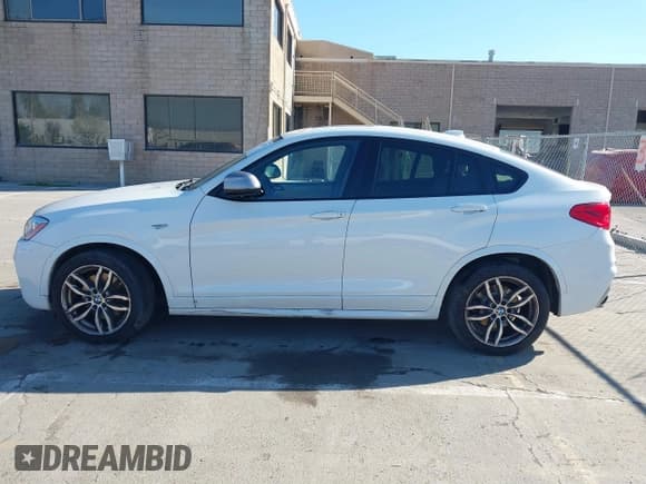 ✅ 2017 BMW X4 M40i • VIN: 5UXXW7C59H0U25191 • Lot: 41867852. Listed on IAAI with 76,301 mi. Free auction sales archive from the USA and detailed vehicle history report at DreamBid. Image 14.