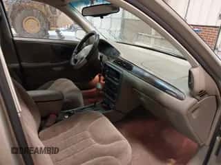 1999 Chevrolet Malibu LS z VIN 1G1NE52M4X6194441, wystawiony jako IAAI lot #41577551 z przebiegiem 94 386 mil mil oraz . Historia ofert i sprzedaży dostępna na DreamBid. Obrazek 5.