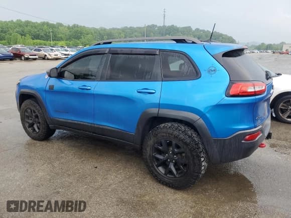 ✅ 2017 Jeep Cherokee Trailhawk • VIN: 1C4PJMBS1HW648716 • Lot: 57490635. Listed on Copart with 94,983 mi. Free auction sales archive from the USA and detailed vehicle history report at DreamBid. Image 2.