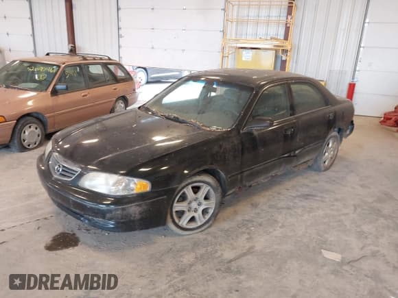 ✅ 2001 Mazda 626 LX • VIN: 1YVGF22D515244864 • Lot: 42595990. Wystawiony na IAAI z przebiegiem 200 929 mil. Bezpłatny archiwum sprzedaży aukcyjnych z USA i szczegółowy raport historii pojazdu na DreamBid. Zdjęcie 2.