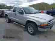 2003 Dodge Dakota Sport z VIN 1D7HG32N13S132871, wystawiony jako IAAI lot #42059965 z przebiegiem 125 408 mil mil oraz . Historia ofert i sprzedaży dostępna na DreamBid. Obrazek 1.