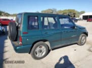 ✅ 1996 Geo Tracker • VIN: 2CNBE1363T6921541 • Лот: 81647384. Опубликован ранее на Copart с пробегом 61 806 миль. Бесплатный доступ к архиву аукционных продаж из США и подробный отчёт об истории автомобиля на DreamBid. Изображение 3.