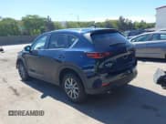 ✅ 2023 Mazda CX-5 S Carbon Edition • VIN: JM3KFBCMXP0282649 • Lot: 42784337. Listed on IAAI with 25,589 mi. Free auction sales archive from the USA and detailed vehicle history report at DreamBid. Image 3.