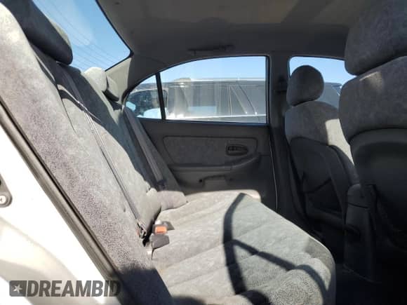 2001 Hyundai Elantra GLS z VIN KMHDN45D71U057338, wystawiony jako Copart lot #79084024 z przebiegiem 137 887 mil mil oraz Szkoda całkowita • Salvage title. Historia ofert i sprzedaży dostępna na DreamBid. Obrazek 10.