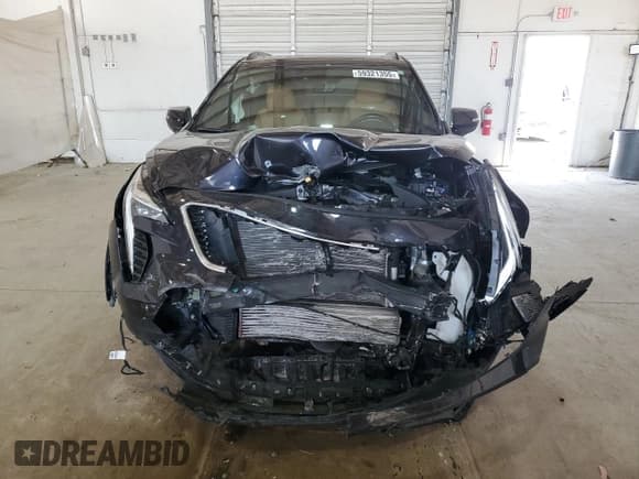 ✅ 2023 Cadillac XT4 AWD Sport • VIN: 1GYFZFR41PF103650 • Лот: 59321355. Опубликован ранее на Copart с пробегом 27 092 миль. Бесплатный доступ к архиву аукционных продаж из США и подробный отчёт об истории автомобиля на DreamBid. Изображение 5.