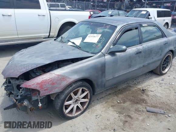 ✅ 1998 Mazda 626 LX • VIN: 1YVGF22D7W5707322 • Lot: 42334677. Wystawiony na IAAI z przebiegiem 347 373 mil. Bezpłatny archiwum sprzedaży aukcyjnych z USA i szczegółowy raport historii pojazdu na DreamBid. Zdjęcie 2.