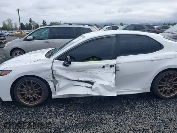 2023 Toyota Camry SE with VIN 4T1G11BKXPU103277, listed as a IAAI auction lot 41978396 with 66,624 mi miles and . Bid and sale history available at DreamBid. Image 6.