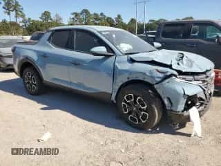 2024 Hyundai Santa Cruz SEL z VIN 5NTJBDDE8RH104510, wystawiony jako Copart lot #77585554 z przebiegiem 10 848 mil mil oraz Szkoda całkowita • Salvage title. Historia ofert i sprzedaży dostępna na DreamBid. Obrazek 4.