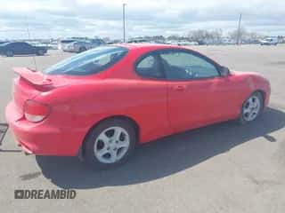 2001 Hyundai Tiburon z VIN KMHJG25F71U226180, wystawiony jako IAAI lot #42123872 z przebiegiem 167 444 mil mil oraz . Historia ofert i sprzedaży dostępna na DreamBid. Obrazek 4.