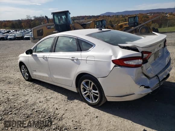 ✅ 2016 Ford Fusion Titanium Hybrid • VIN: 3FA6P0RUXGR293160 • Lot: 91189245. Listed on Copart with 91,293 mi. Free auction sales archive from the USA and detailed vehicle history report at DreamBid. Image 2.
