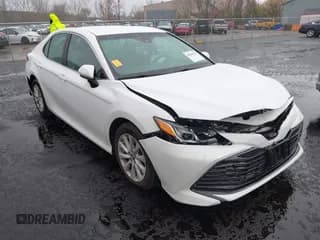 ✅ 2018 Toyota Camry LE • VIN: 4T1B11HK7JU117100 • Lot: 43565126. Listed on IAAI with 37,334 mi. Free auction sales archive from the USA and detailed vehicle history report at DreamBid. Image 1.