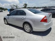 ✅ 2010 Ford Fusion Hybrid • VIN: 3FADP0L39AR182968 • Lot: 66120535. Wystawiony na Copart z przebiegiem 105 952 mil. Bezpłatny archiwum sprzedaży aukcyjnych z USA i szczegółowy raport historii pojazdu na DreamBid. Zdjęcie 2.