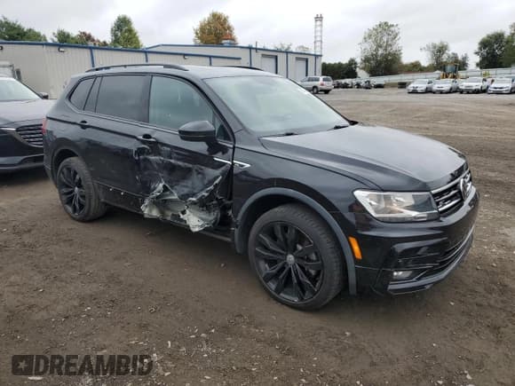 ✅ 2021 Volkswagen Tiguan SE • VIN: 3VV2B7AX1MM067735 • Lot: 86079125. Listed on Copart with 83,584 mi. Free auction sales archive from the USA and detailed vehicle history report at DreamBid. Image 4.