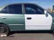 2005 Hyundai Accent GLS z VIN KMHCG45C95U620716, wystawiony jako IAAI lot #41740573 z przebiegiem 187 971 mil mil oraz . Historia ofert i sprzedaży dostępna na DreamBid. Obrazek 14.