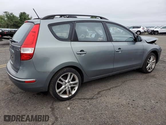 2010 Hyundai Elantra SE with VIN KMHDC8AE6AU068617, listed as a Copart auction lot 69657295 with 84,999 mi miles and Salvage title. Bid and sale history available at DreamBid. Image 3.