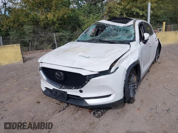 ✅ 2021 Mazda CX-5 Touring • VIN: JM3KFBCM7M0477474 • Lot: 43434996. Listed on IAAI with 76,683 mi. Free auction sales archive from the USA and detailed vehicle history report at DreamBid. Image 2.