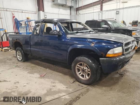 2003 Dodge Dakota Sport z VIN 1D7HG32N43S328884, wystawiony jako Copart lot #85985644 z przebiegiem 141 779 mil mil oraz Nie do naprawy • Non repairable. Historia ofert i sprzedaży dostępna na DreamBid. Obrazek 4.