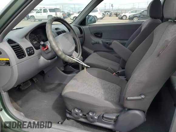 2003 Hyundai Accent GL z VIN KMHCG35C13U270585, wystawiony jako Copart lot #50197935 z przebiegiem 53 822 mil mil oraz Szkoda całkowita • Salvage title. Historia ofert i sprzedaży dostępna na DreamBid. Obrazek 7.