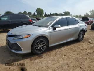 2023 Toyota Camry Hybrid XLE with VIN 4T1F31AK9PU601333, listed as a Copart auction lot 67548825 with 38,386 mi miles and Salvage title. Bid and sale history available at DreamBid. Image 1.