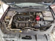 ✅ 2011 Ford Fusion S • VIN: 3FAHP0GAXBR260203 • Лот: 93601985. Опубликован ранее на Copart с пробегом 215 661 миль. Бесплатный доступ к архиву аукционных продаж из США и подробный отчёт об истории автомобиля на DreamBid. Изображение 11.