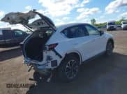 ✅ 2023 Mazda CX-5 S Premium Plus • VIN: JM3KFBEM7P0119504 • Lot: 42334113. Listed on IAAI with 41,628 mi. Free auction sales archive from the USA and detailed vehicle history report at DreamBid. Image 4.