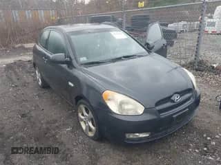 2009 Hyundai Accent Auto SE z VIN KMHCN36C29U125830, wystawiony jako IAAI lot #43595072 z przebiegiem 97 788 mil mil oraz . Historia ofert i sprzedaży dostępna na DreamBid. Obrazek 1.