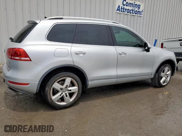 ✅ 2013 Volkswagen Touareg Exec • VIN: WVGEF9BP9DD011432 • Lot: 61800405. Listed on Copart with 187,342 mi. Free auction sales archive from the USA and detailed vehicle history report at DreamBid. Image 3.